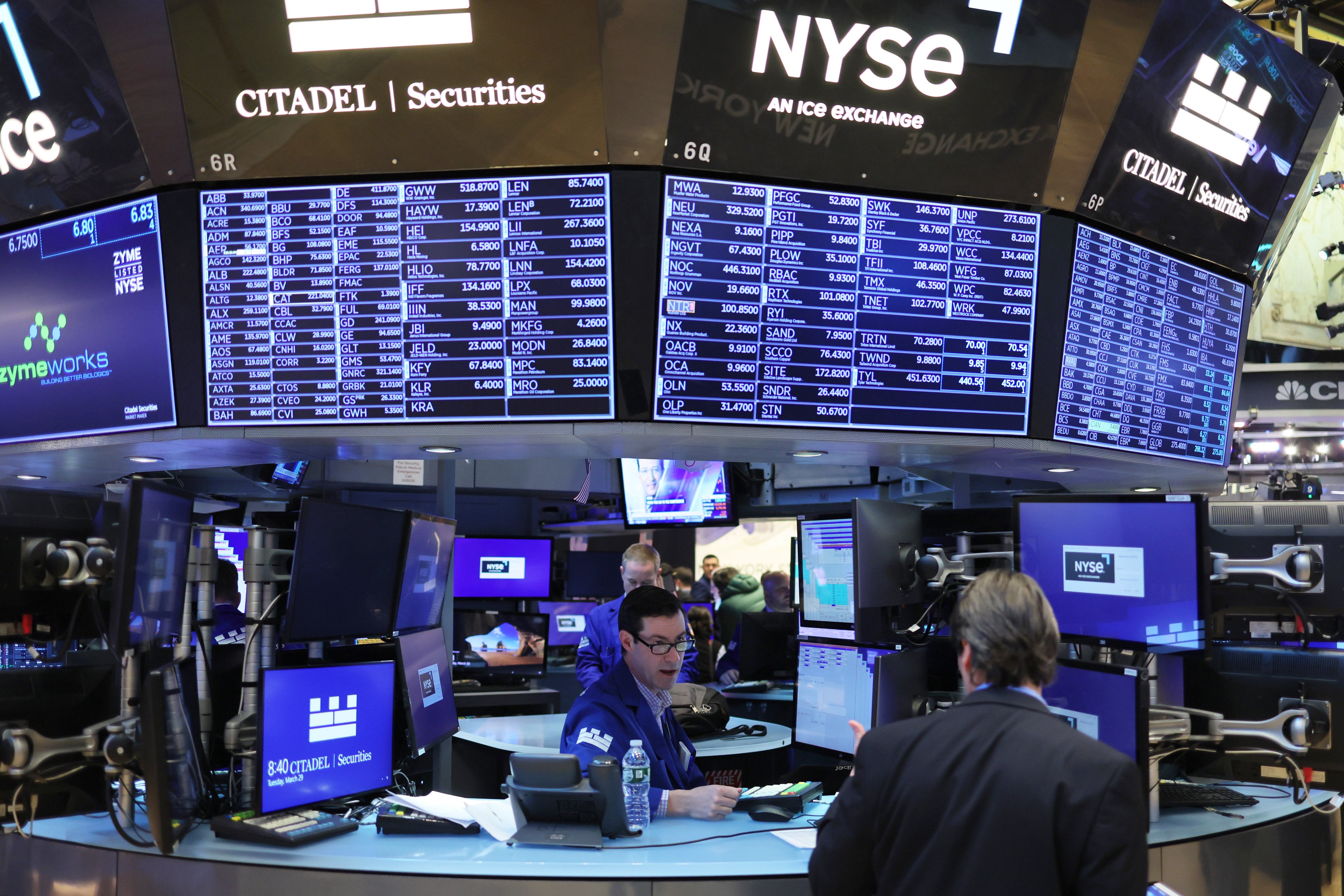 Wall Street trading floor green stock market rally tech sector rebound micron qualcomm charts